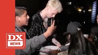 Machine Gun Kelly Signs Autograph Then Immediately DESTROYS It After Fan Brings Up Eminem [upl. by Nnaarat102]